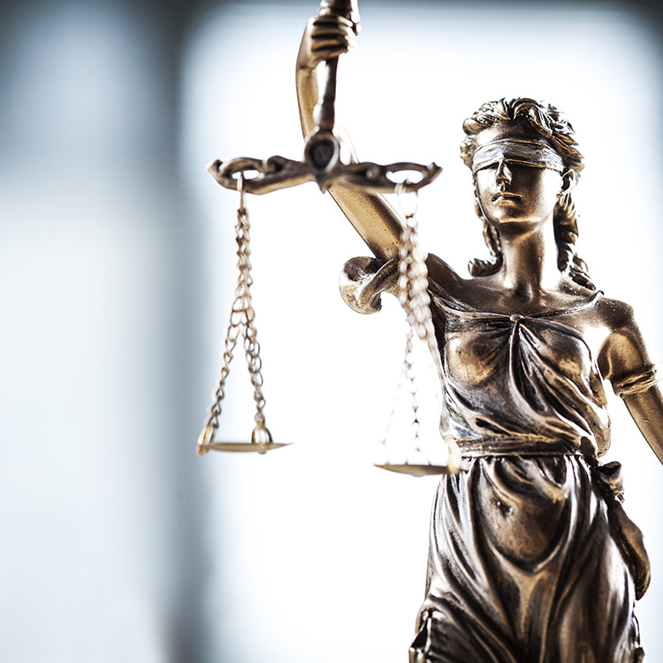 Lady justice holding the scales of justice in front of her